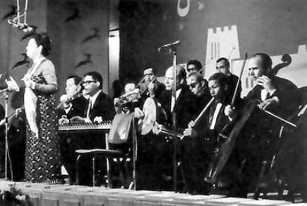 With her orchestra (http://www.afropop.org/multi/interview/ID/73/Virginia%20Danielson%20on%20Umm%20Kulthum)