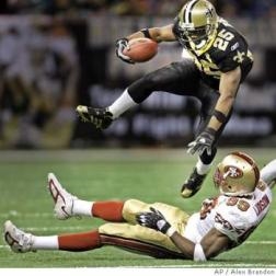 Reggie Bush runs over a 49er (google images)
