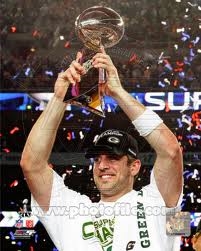 Aaron Rodgers holding the Super Bowl trophy (Google)