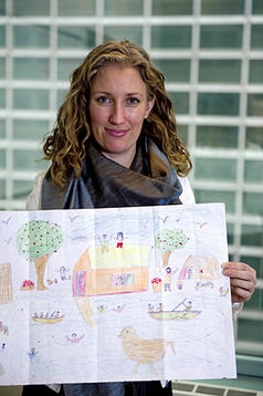 Pernille Ironside, a UNICEF child protection specialist, holds a child’s depiction of Pakistan’s flo