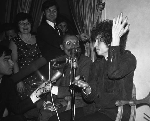 In this May 22, 1966, file photo, Bob Dylan gestures during a news conference in Paris, France. Dylan won the 2016 Nobel Prize in literature on Thursday, Oct. 13, 2016, a stunning announcement that for the first time bestowed the prestigious award on a musician for 