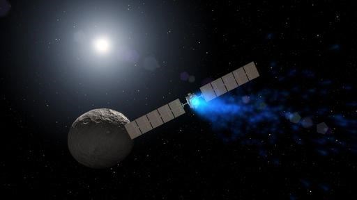 This artist rendering by NASA shows the Dawn spacecraft orbiting the dwarf planet Ceres. New findings presented at the American Geophysical Union meeting on Thursday, Dec. 15, 2016 show that ice can exist in permanently shadowed craters on Ceres and is widespread below the surface. Dawn has been studying Ceres since 2015 after a stop at the asteroid Vesta. (NASA via AP)