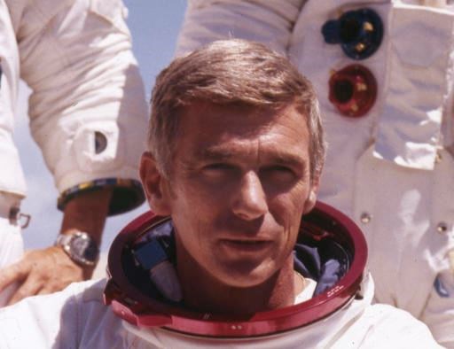 In an undated file photo provided by NASA, US Navy Commander and Astronaut for the upcoming Apollo 17, Eugene Cernan, is pictured in his space suit. NASA announced that former astronaut Cernan, the last man to walk on the moon, died Monday, Jan. 16, 2017, surrounded by his family. He was 82. (NASA via AP)