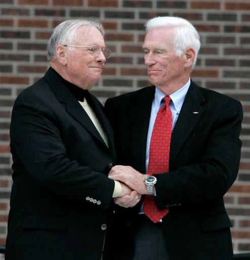 In a Oct. 27, 2007 file photo, former astronaut Neil Armstrong, left, is congratulated by fellow ex-astronaut Gene Cernan following the dedication ceremony of the Neil Armstrong Hall of Engineering at Purdue University in West Lafayette, Ind. NASA announced that former astronaut Gene Cernan, the last man to walk on the moon, died Monday, Jan. 16, 2017, surrounded by his family. He was 82. (AP Photo/Michael Conroy, File)