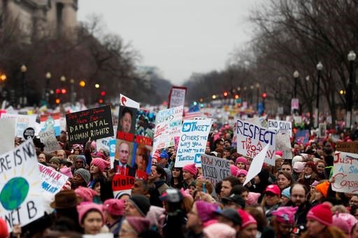 Protesters move along Constitution Avenue at the Women's March on Washington during the first full day of Donald Trump's presidency, Saturday, Jan. 21, 2017 in Washington. (AP Photo/John Minchillo)