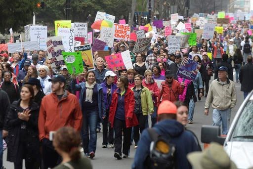 Crowds march up Church Street towards Romare Bearden Park during Saturday's Women's March on Charlotte, which drew at least 10,000 people according to CMPD. The mile-long march was scheduled to coincide with a national demonstration Saturday, Jan. 21, 2017, in Washington, D.C., the day after Donald Trump's inauguration as president. The march started at First Ward Park, traveled down Tryon Street to 4th St. to Church St. and ended at Romare Bearden Park. 
