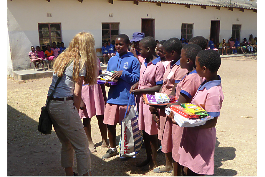Julie Phippen, founder of Sewpportive Friends, visited rural village schools in Zimbabwe last summer to deliver kits that she and others had made. (Courtesy of Sewpportive Friends)