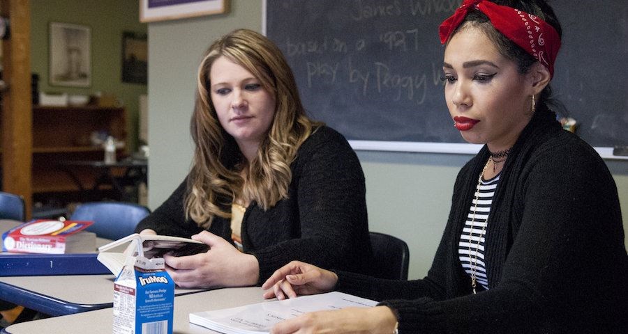 Students and single moms Coralys Perez (r.) and Sam Jordan (l.) are taking courses at The Care Center microcollege in Holyoke, Mass., to earn a liberal arts associate's degree. (Josh Kenworthy/The Christian Science Monitor)