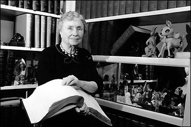 <a href=http://www.time.com/time/time100/heroes/profile/keller01.html>Helen Keller holding a book in 1955</a>  