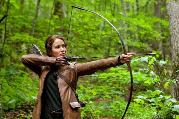 Jennifer Lawrence portrays Katniss Everdeen in a scene from the movie 'The Hunger Games,' opening March 23, 2012. The movie has spawned fan-based efforts online to fight hunger in the real world.  <P>AP Photo/Lionsgate, Murray Close