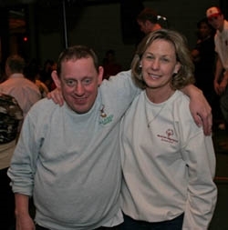 Lisa spends time with an athlete at a dance. (Special Olympics Connecticut)