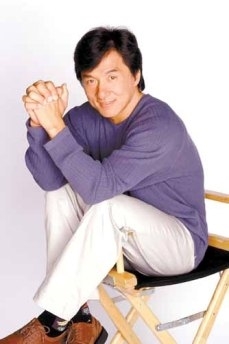 Jackie Chan sitting in a  directors' chair (http://www.google.com/images?hl=en&safe=active&gbv=2&tbs=isch:1&q=jackie+chan&sa=N&start=60&ndsp=20)