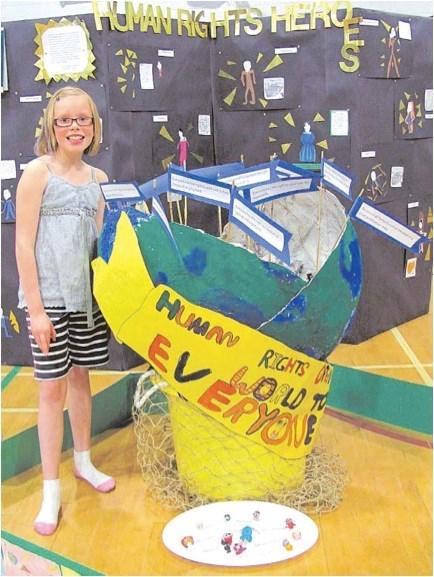 "I thought it would be fun to learn about humans and how they helped their communities," said grade 3 student Chantel Kennedy, who chose to learn about human rights heros during Notre Dame Elementary school's My Hero project at the Morinville school. With cross-grade groupings, students in gr. 1-5 worked together to learn about others who have made a positive change in the world and to realize we each have that potential. --photos by Cynthia Wandler