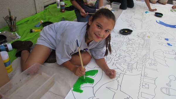 Laguna Beach Boys and Girls Club student poses for a picture during the mural painting <P>(Photo courtesy of Robin Wethe Altman)
