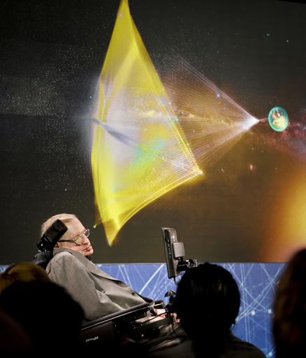 Renowned cosmologist Stephen Hawking, right, seated in a speech adaptive wheelchair, discuss the new Breakthrough Initiative focusing on space exploration and the search for life in the universe, during a press conference on Tuesday, April 12, 2016, at One World Observatory in New York. The $100 million project is aimed at establishing the feasibility of sending a swarm of tiny spacecraft, each weighing far less than an ounce, to the Alpha Centauri star system. (AP Photo/Bebeto Matthews)
