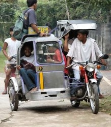 <a href=http://www.envirofit.org/>A tricycle taxi in Vigan </a>