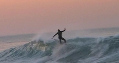 A Blue Water Task Force member enjoys the waves. (myhero.com)