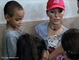 Shania Twain with the young children she seeks ou (http://www.shaniasplace.com)