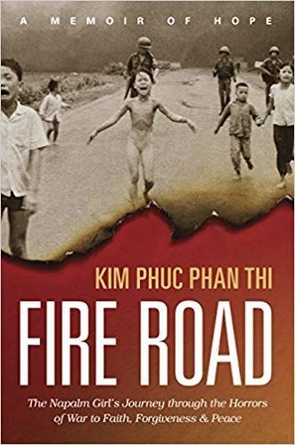 Book cover for the book Fire Road by Kim Phuc. Features famous photo of children running from napalm attack during Vietnam War.