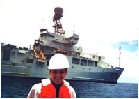 Courtney Schumacher taking sea surface measurements near the R/V Ronald H. Brown during the Tropical East Pacific Process Studies cruise in the tropical east Pacific Ocean, summer 1997. (Image courtesy of the University of Washington)