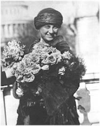 Mrs. Huck received flowers from Alice  Robertson, the 2nd woman elected to congress, on the day of her swearing in. (Image courtesy of Library of Congress)