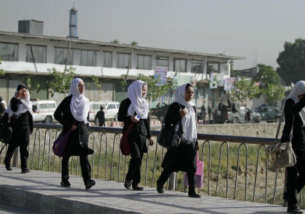 Afghan school girls walk near the entrance gate of the presidential palace after an attack by the Taliban in Kabul, Afghanistan, Tuesday, June 25.	 <P>(Ahmad Jamshid/AP)